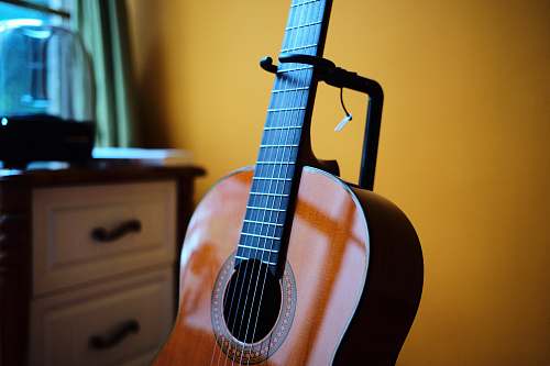 leisure activities tilt shift lens photo of brown acoustic guitar guitar
